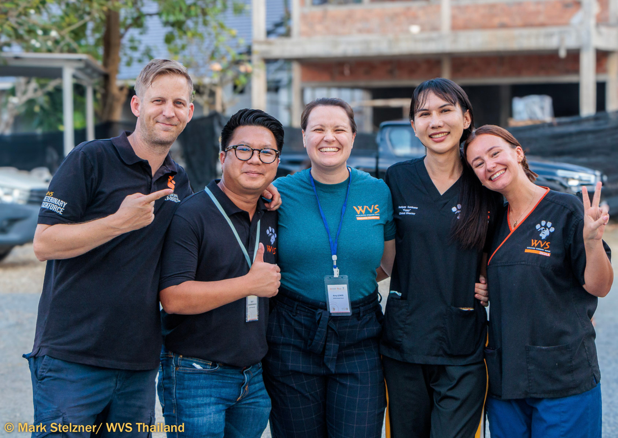 A group of people smiling.