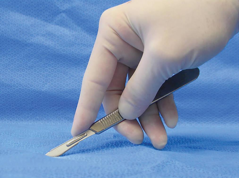 Figure 3 - Fingertip grip with additional guidance from index finger placed on top of the scalpel.