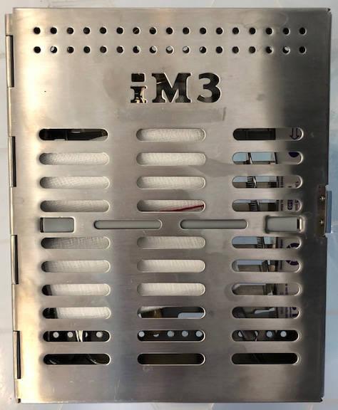 Figure 2 - Metal drum for holding items for autoclaving.