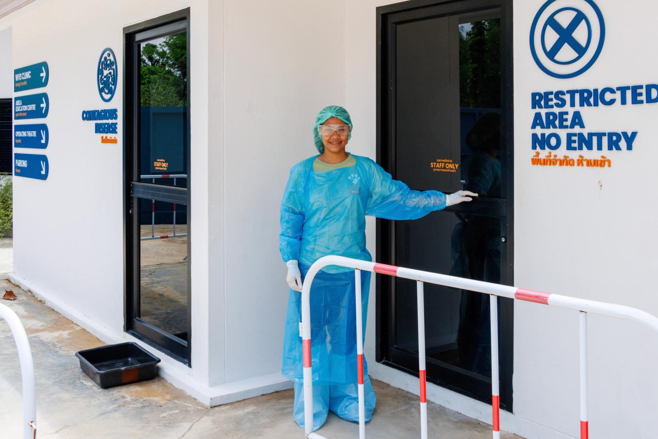 member of staff outside an isolation facility