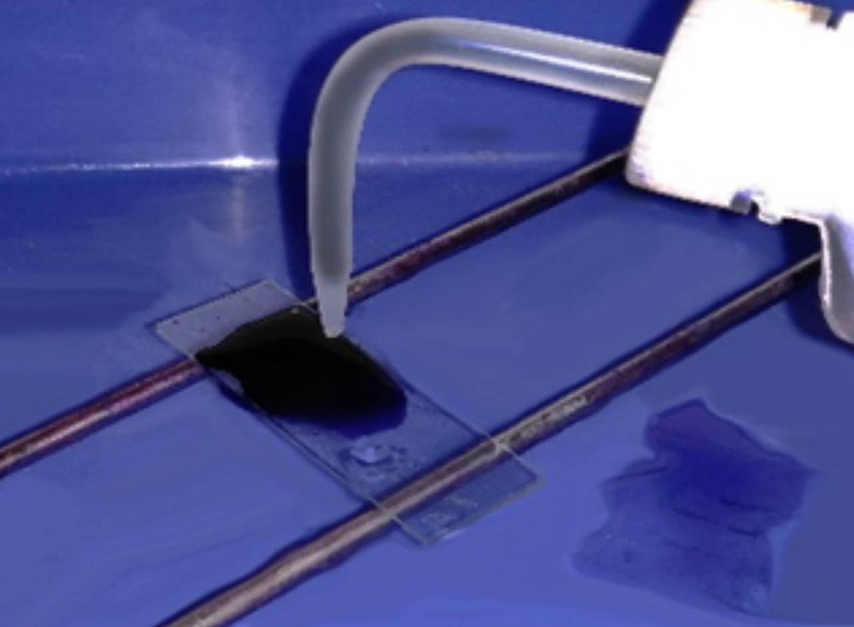 Figure 3 — Completely cover the slide with Giemsa stain.