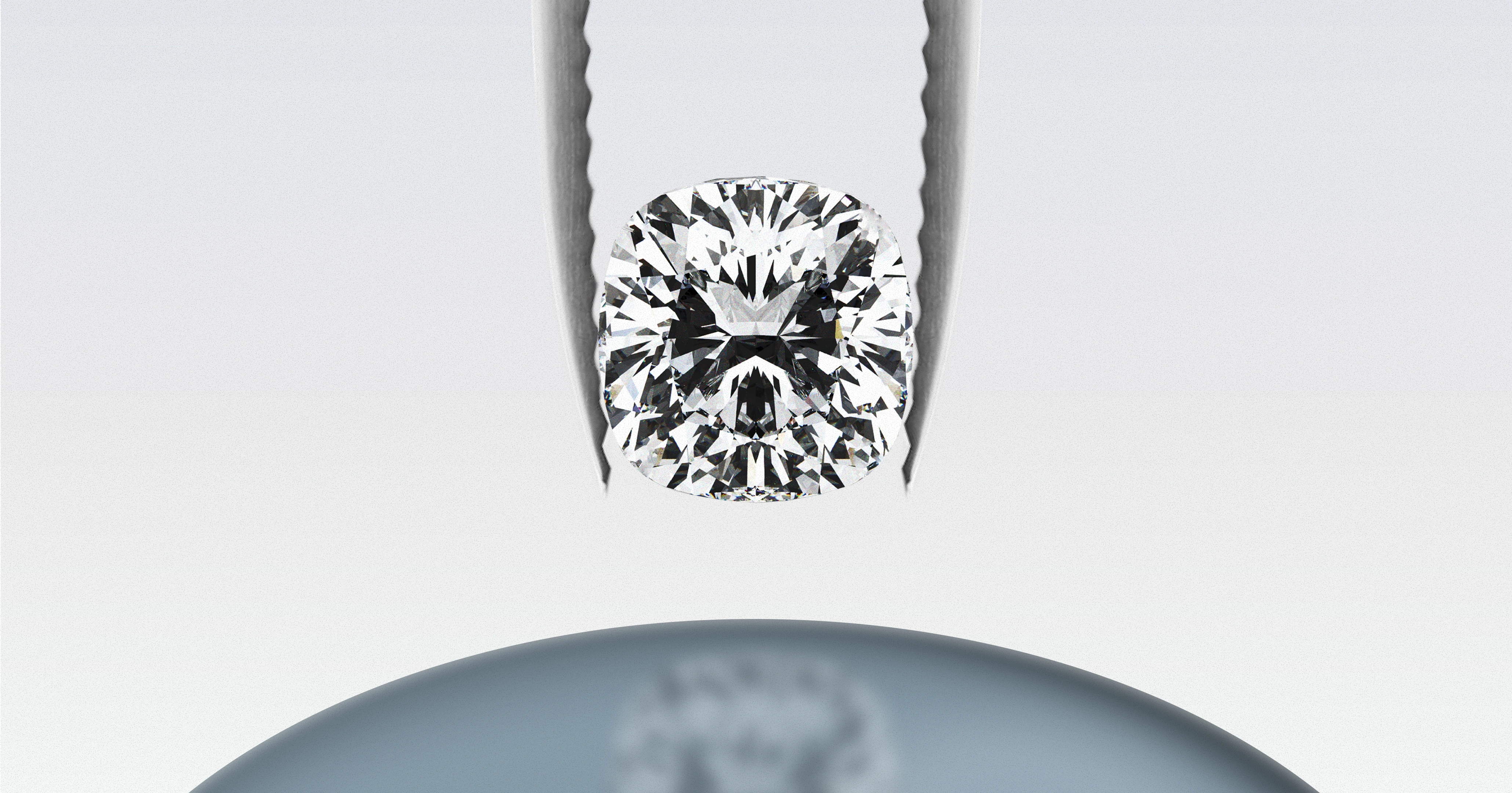 Cushion-cut diamond held in tweezers above a reflective surface