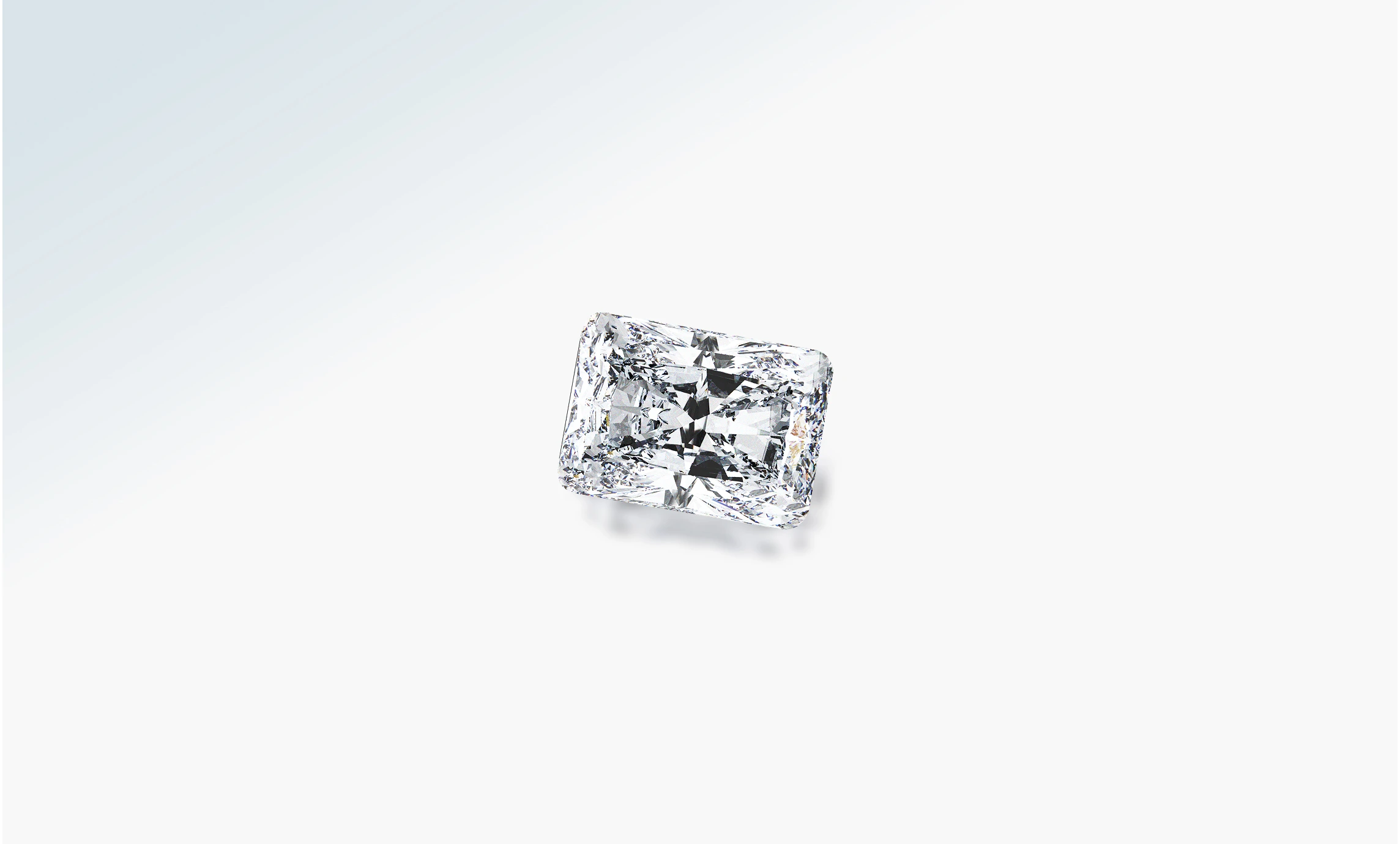 Loose rectangular radiant-cut diamond on a pale background