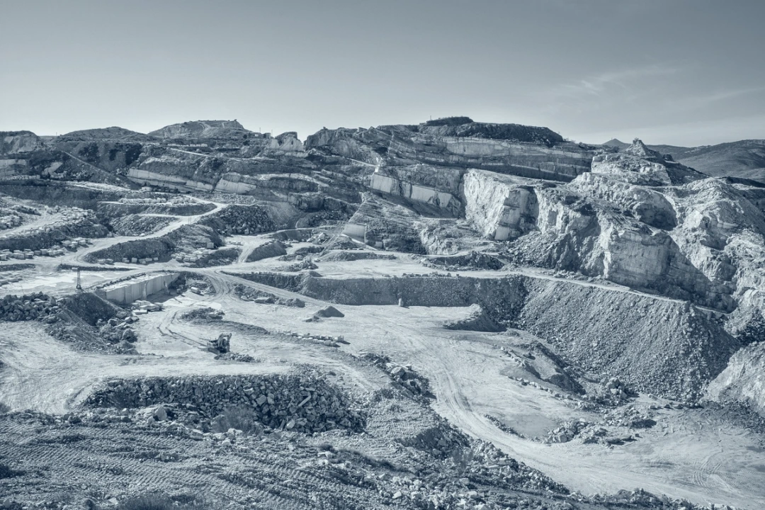 Terraced stone quarry showing the landscape where natural materials begin