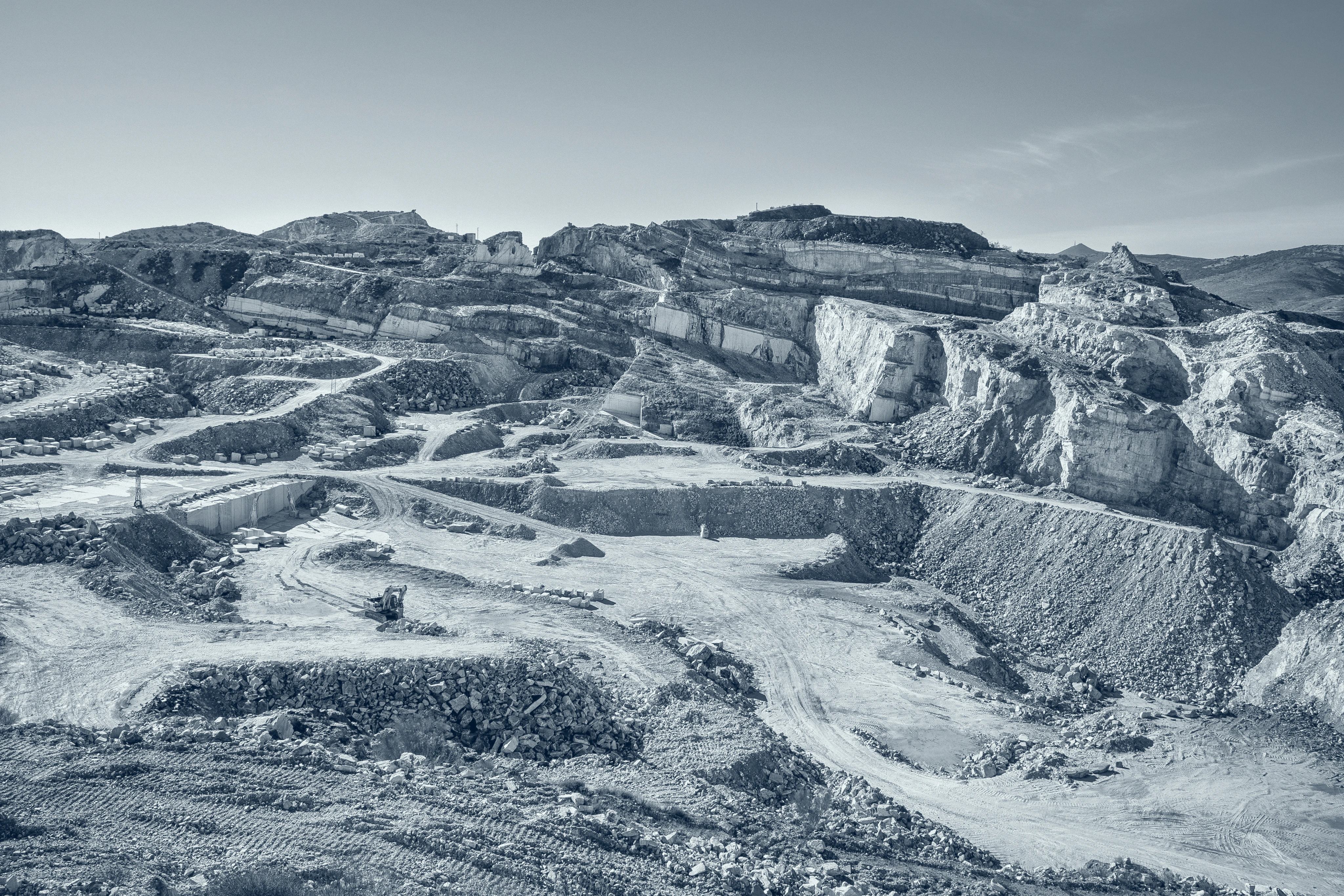 Terraced stone quarry showing the landscape where natural materials begin