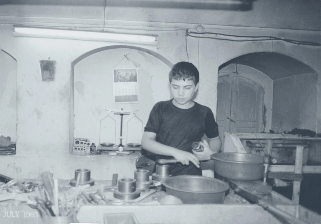 Young boy at the family jewelry workbench, July 1983