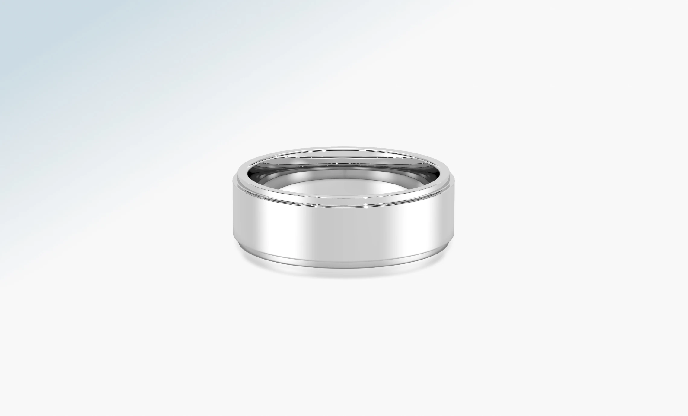 Polished platinum wedding band on a pale background