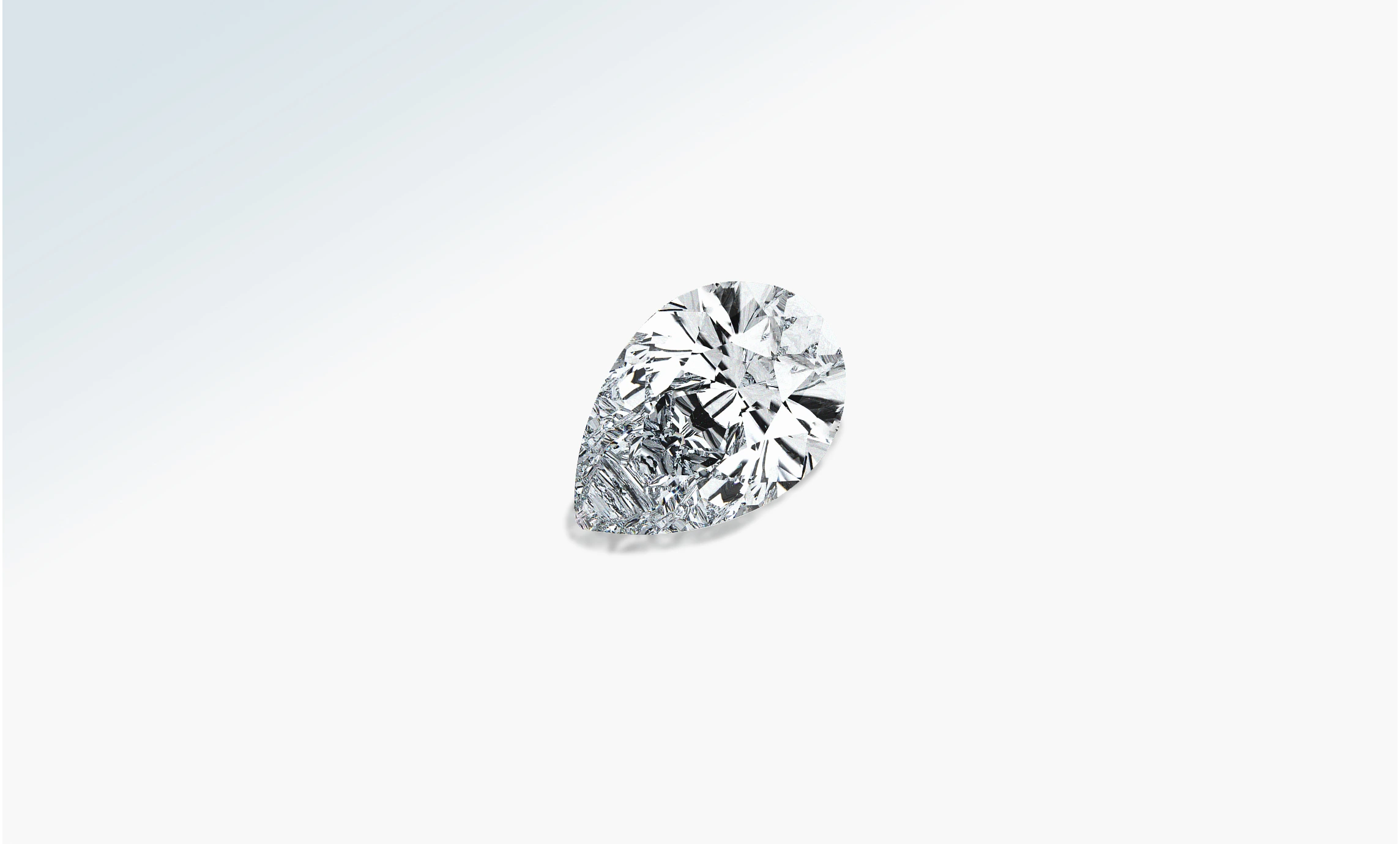 Loose pear-shaped brilliant diamond on a pale background