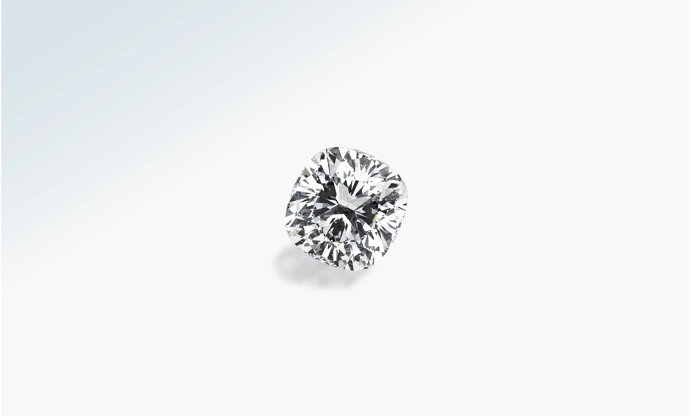 Loose cushion-cut brilliant diamond on a pale background