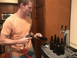 guy filling bottles