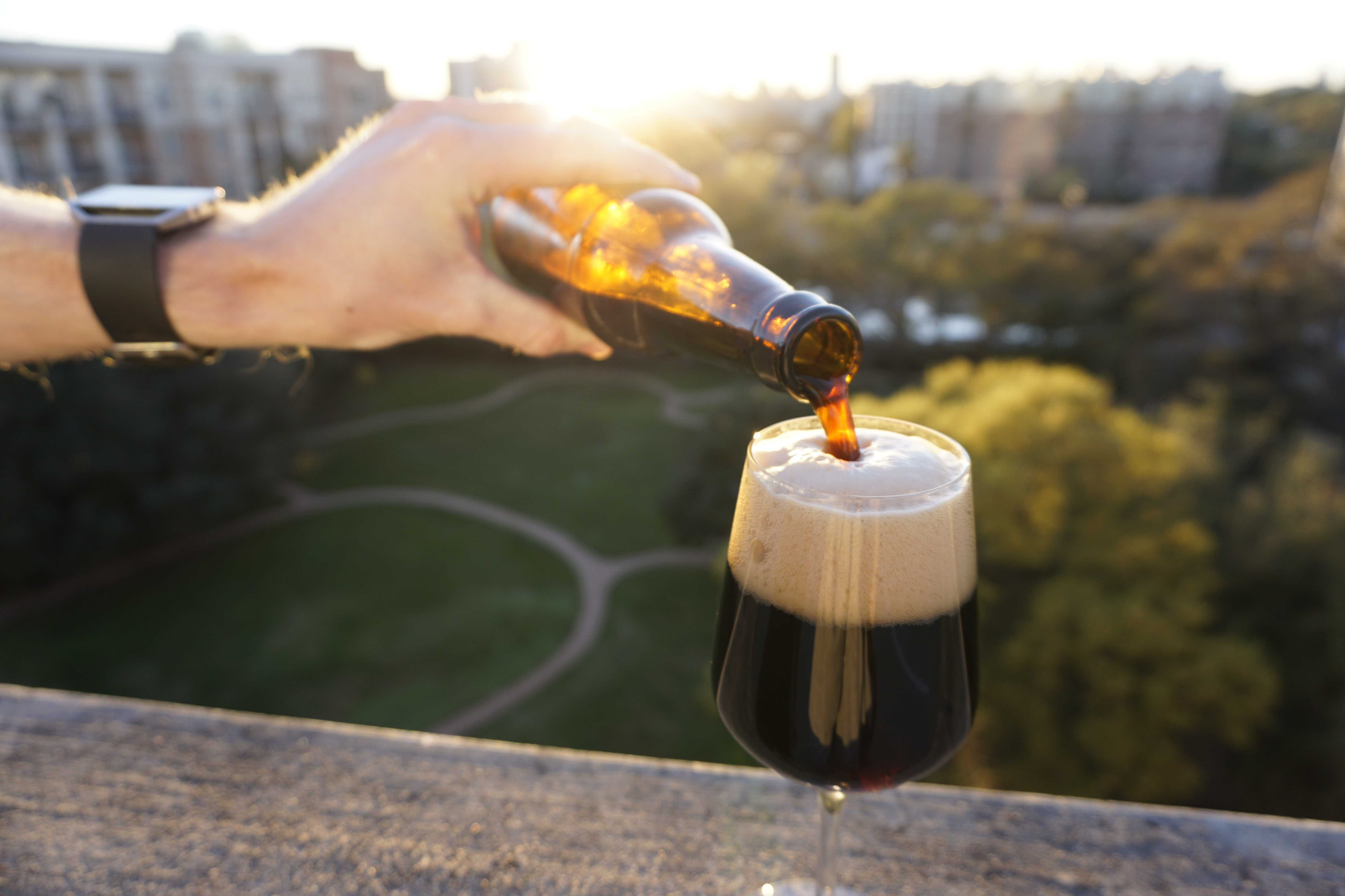 pouring beer in the sun
