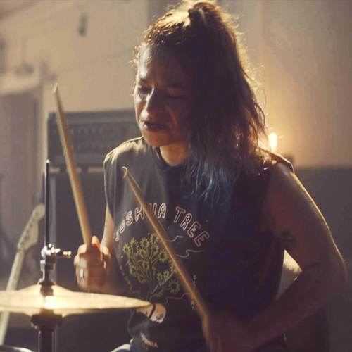 Lya playing drums