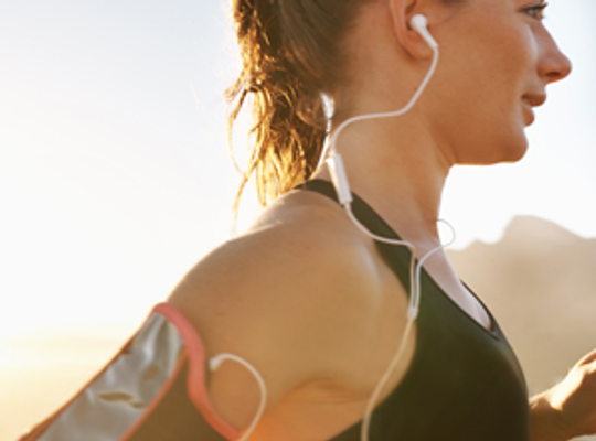 Lady running with earphones in.