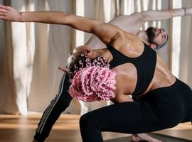 a man and a woman stretching, excessive backsweat