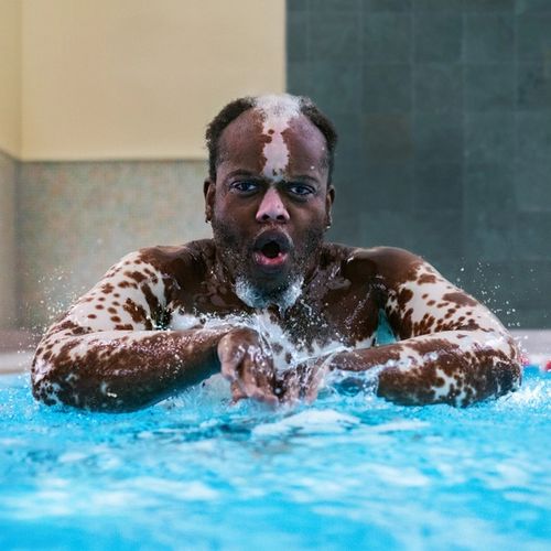 Bashir swimming in a pool