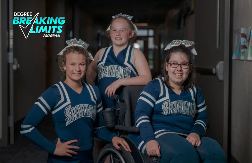 Three girls, with one sitting on a wheelchair