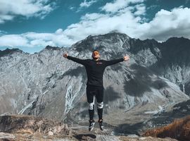 Man jumping in front of mountains