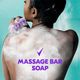 Woman washing with tagline : massage bar soap