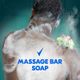 Man washing with tagline massage bar soap