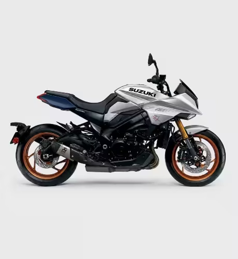 Motocicleta Suzuki Katana plateada con llantas doradas vista de perfil