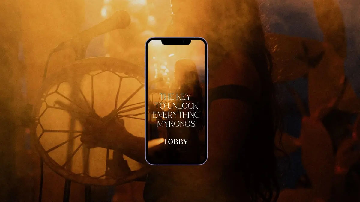 THE LOBBY app displayed on a smartphone during a Mykonos nightlife event.