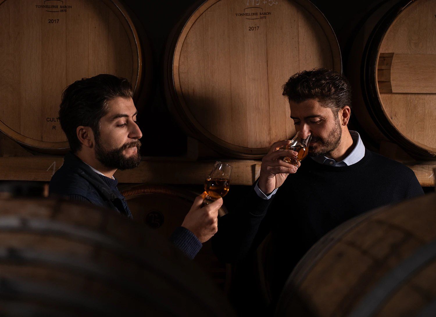 Oak barrels ageing Sangiovese in a Chianti Classico cellar
