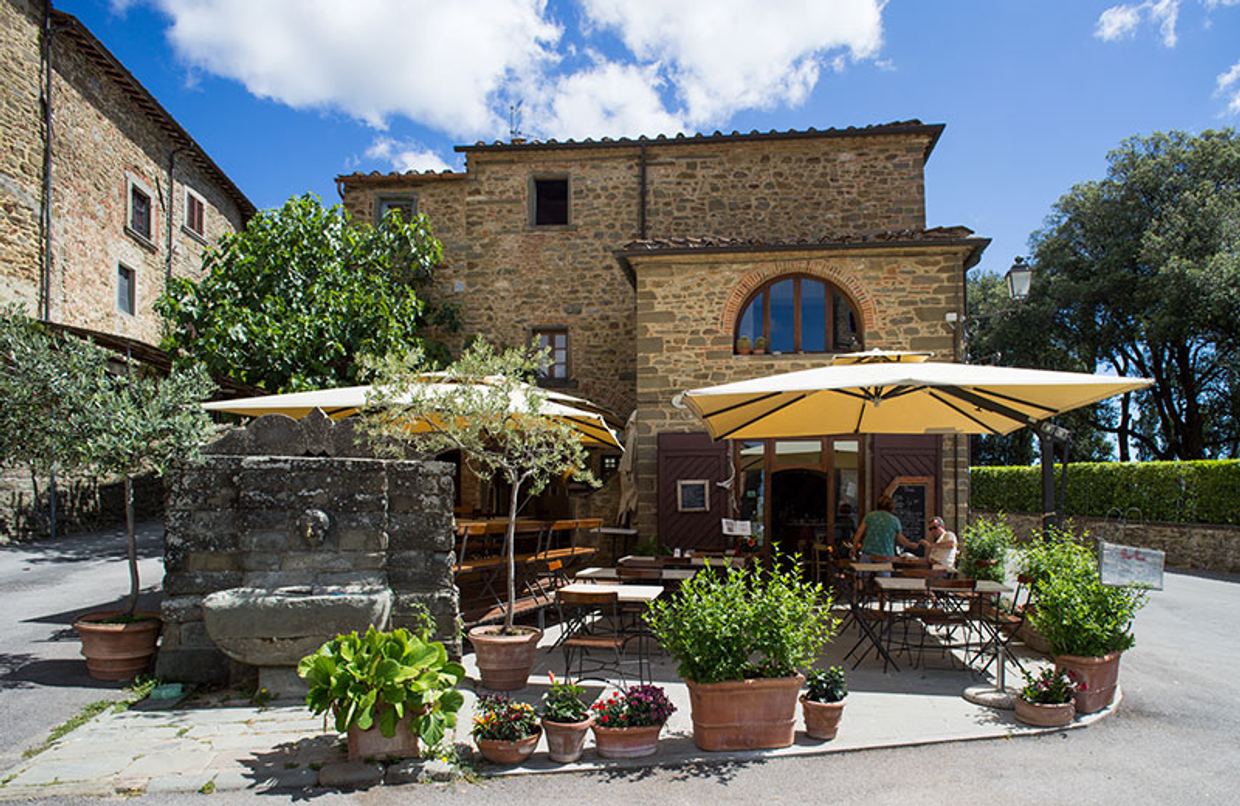 A glass of Chianti Classico on the terrace at Bar Ucci, the only bar in the medieval hamlet of Volpaia