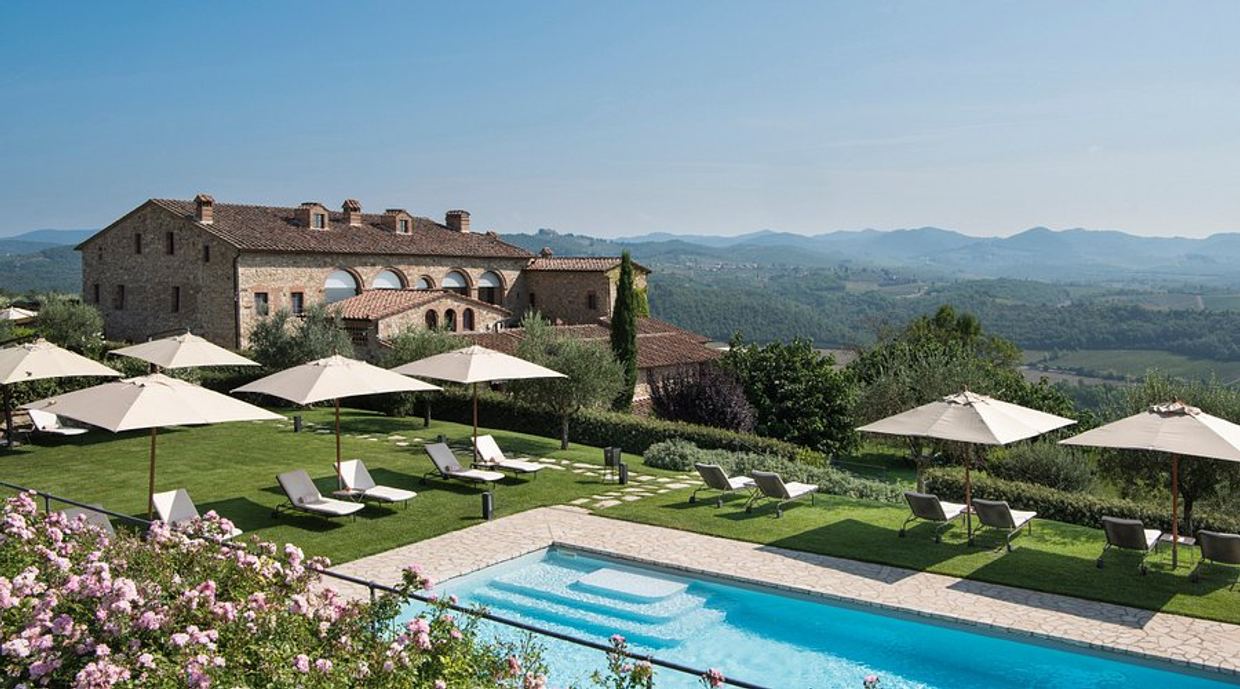 The pool and vineyard panorama at Hotel Le Fontanelle near Pianella, Castelnuovo Berardenga