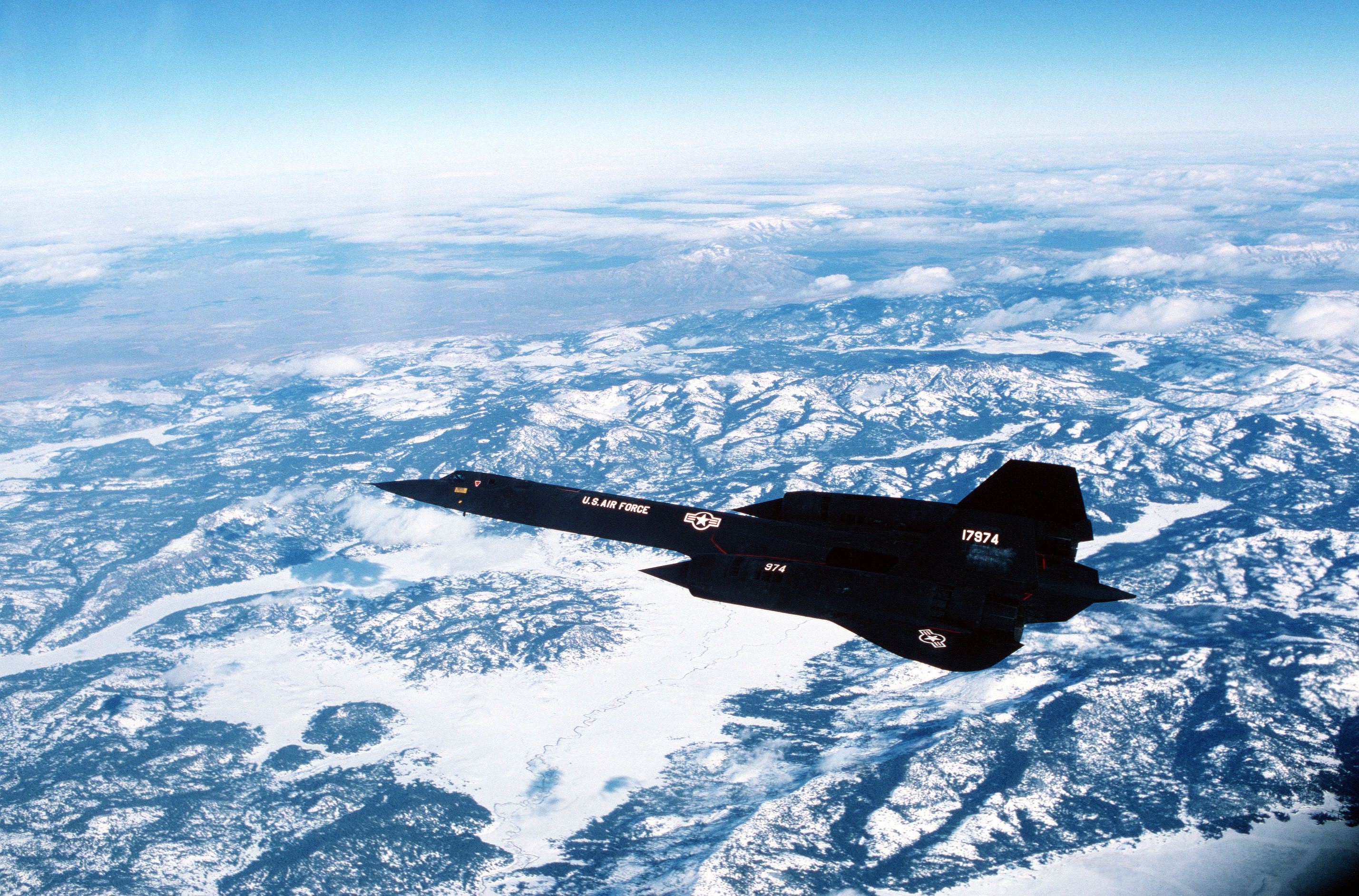 SR-71 Blackbird flying over mountains