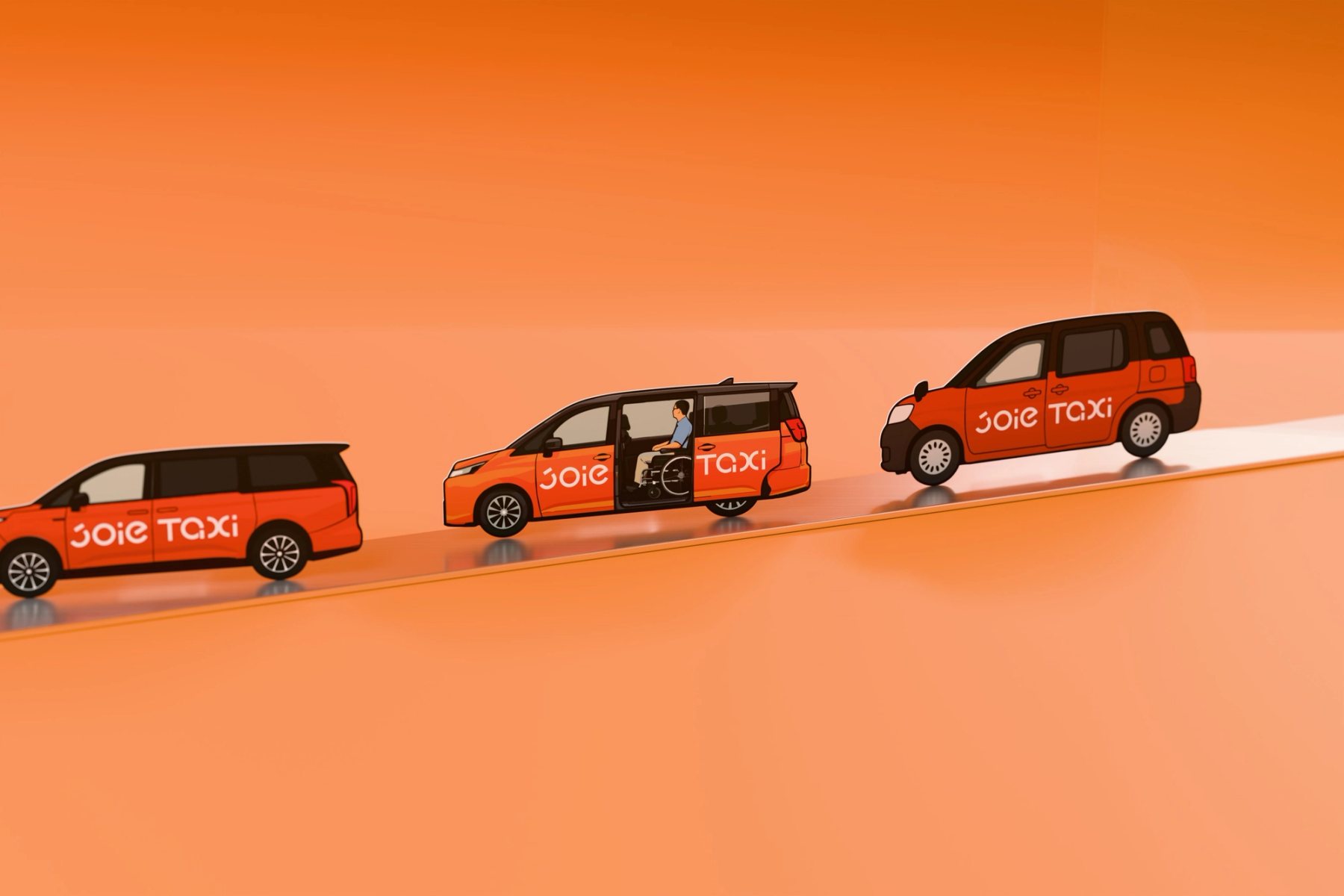 JOIE 樂行三款車型造形名片在橘色斜坡上依序前進 / Three JOIE Taxi vehicle-shaped cards moving along an orange ramp.