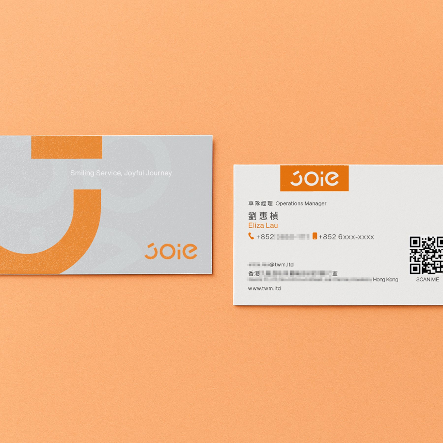 JOIE 樂行灰橘雙面名片，正面以灰色幾何搭配橘色品牌符號。 / JOIE Taxi dual-sided business card with grey geometric shapes and orange brand mark.