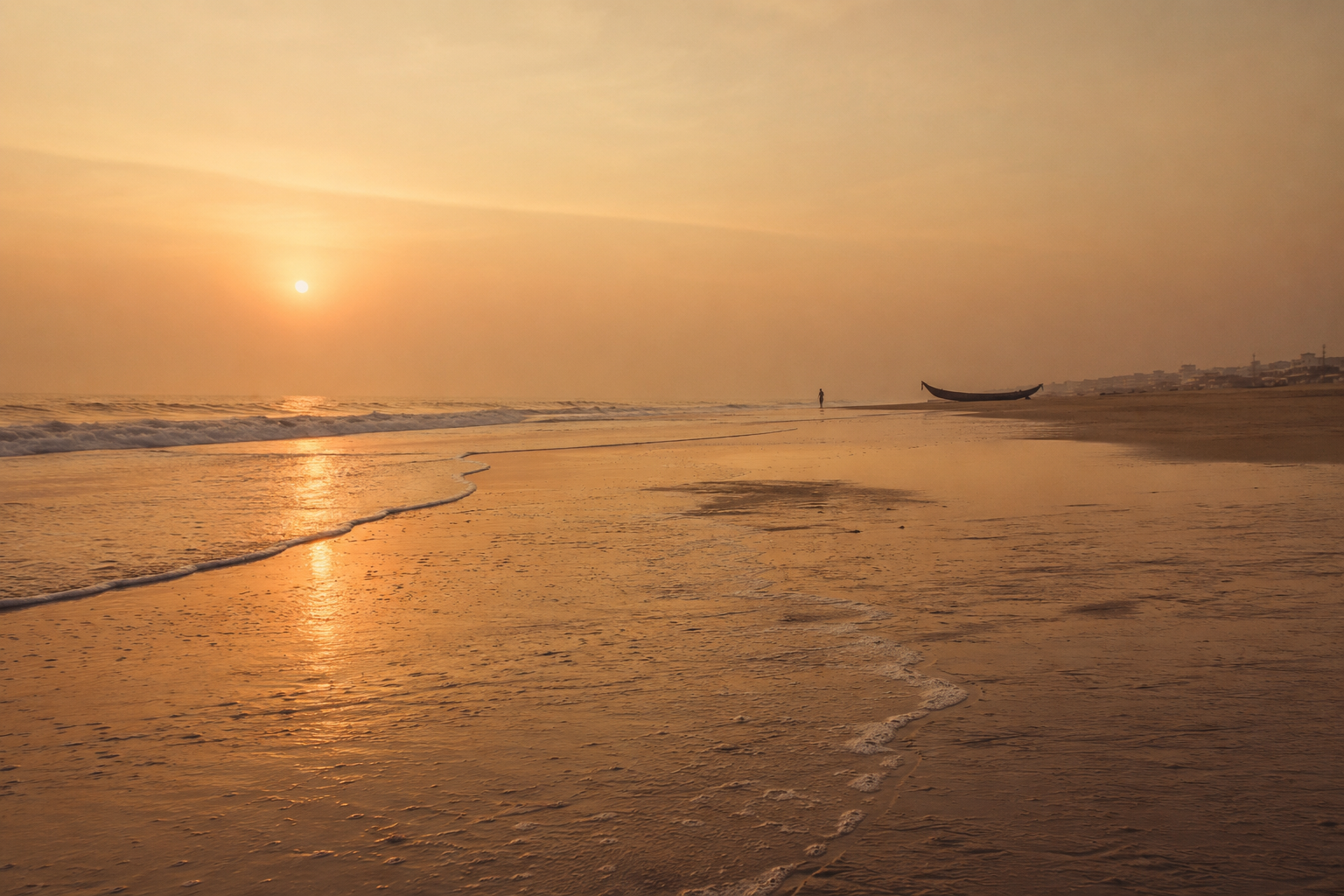 Dawn over the Bay of Bengal at Puri's Golden Beach, the tide receding over wide wet sand