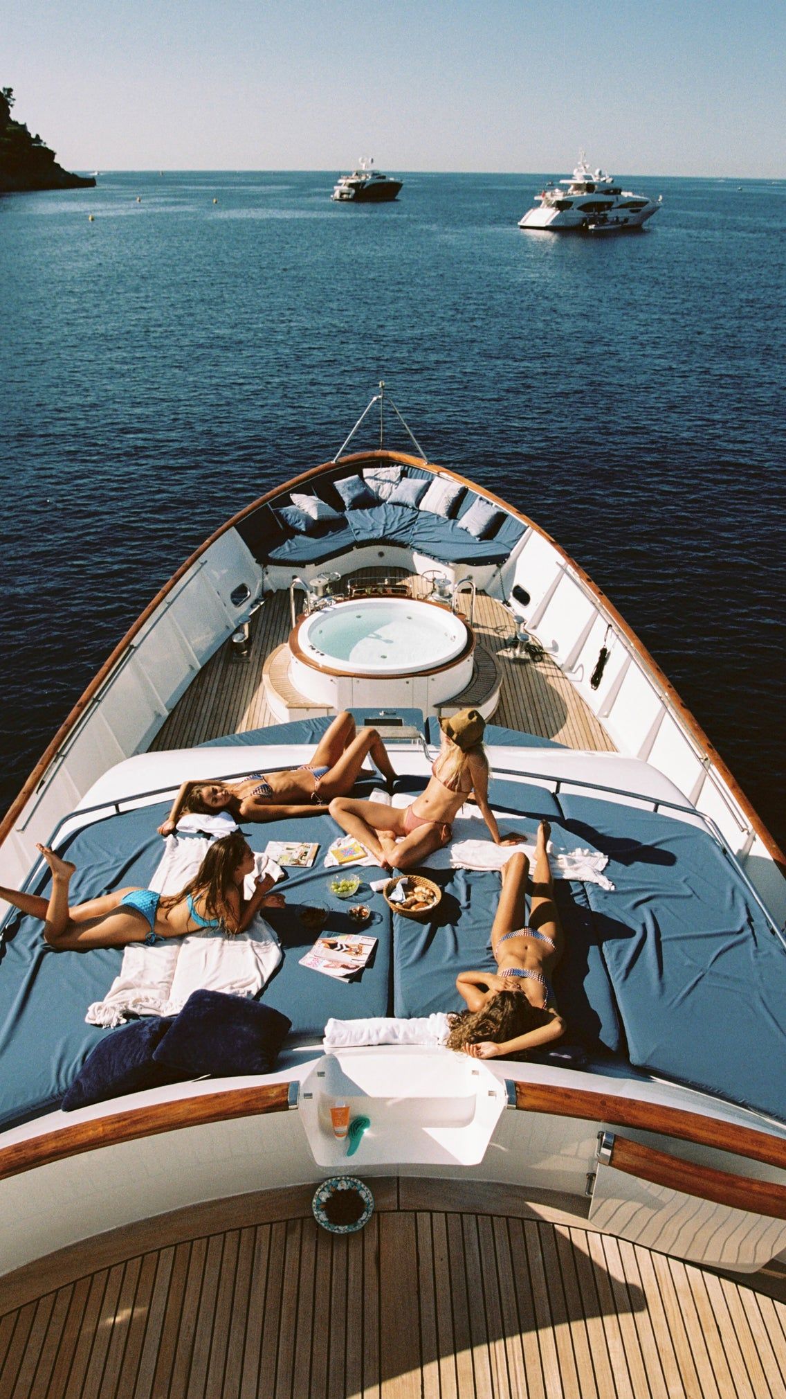 Friends relaxing together on the open deck of a yacht