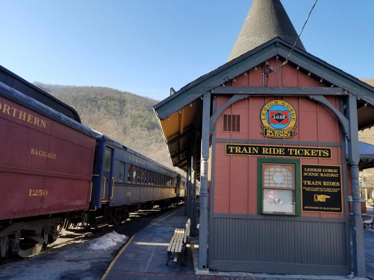 A vintage passenger train on the Lehigh Gorge Scenic Railway, following the Lehigh River through Lehigh Gorge State Park.