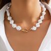 Gold and white necklace