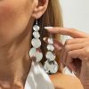 01 White K Earrings