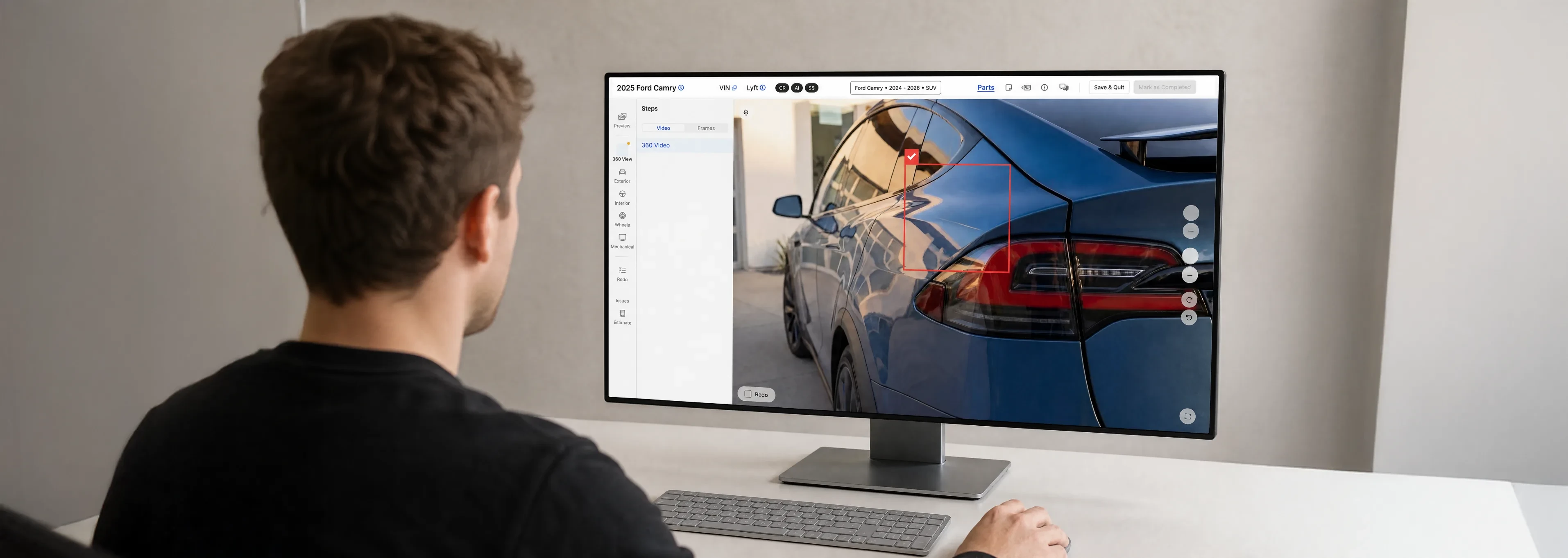 Reviewer at a desktop reviewing a flagged damage area in the Self Inspection review screen