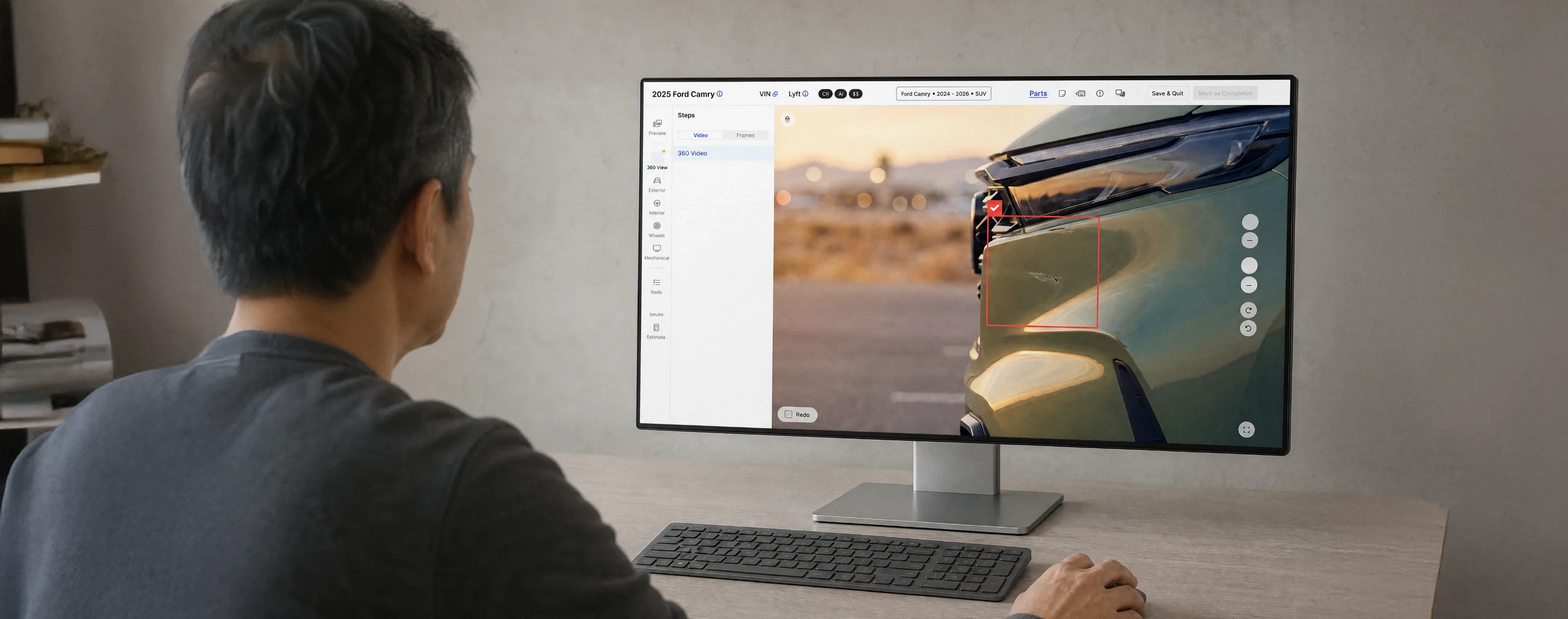Reviewer checking a flagged dent on a vehicle inspection at a desktop monitor