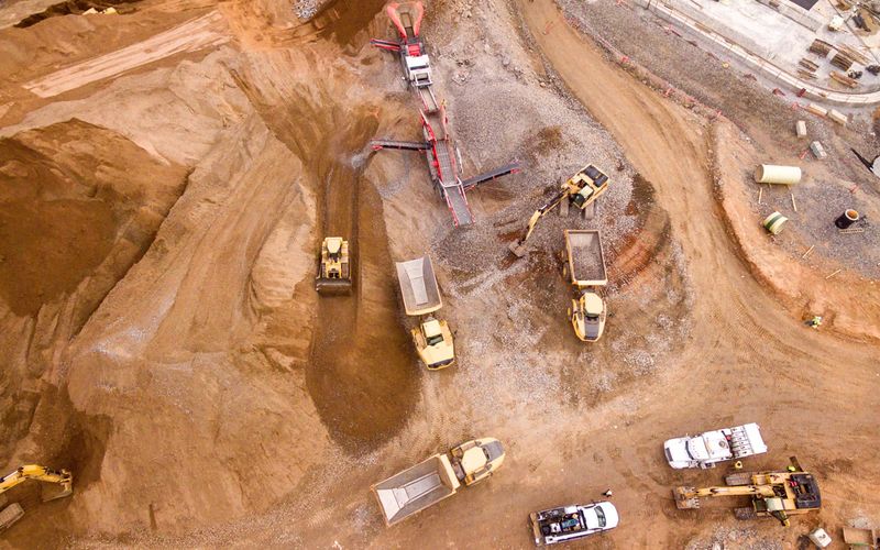 Aerial view of mine with trucks