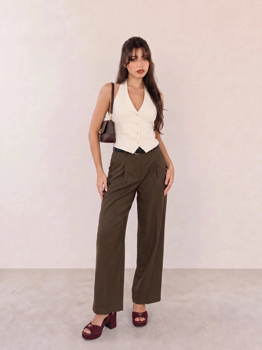 Old money look with ivory halter waistcoat top & brown wide-leg trousers and burgundy platform sandals
