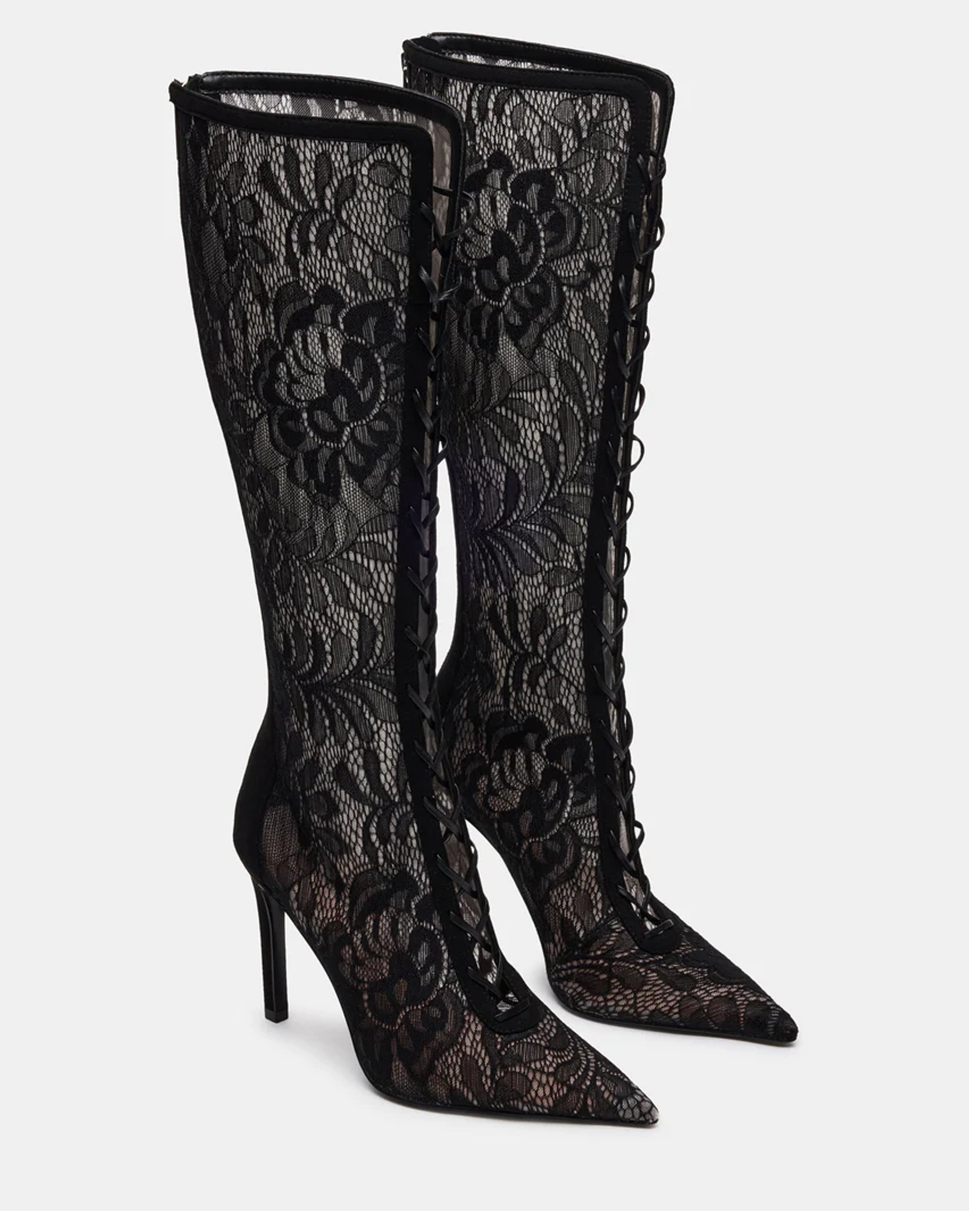 Black lace lace-up knee boots styled with a sheer lace halter top and twist-front midi skirt