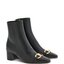 Schwarze Stiefeletten mit goldfarbener Trense