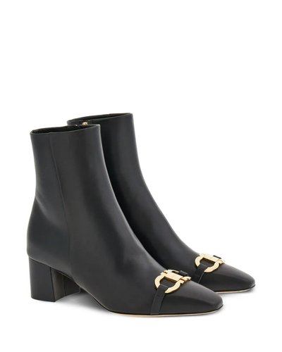 Schwarze Stiefeletten mit goldfarbener Trense