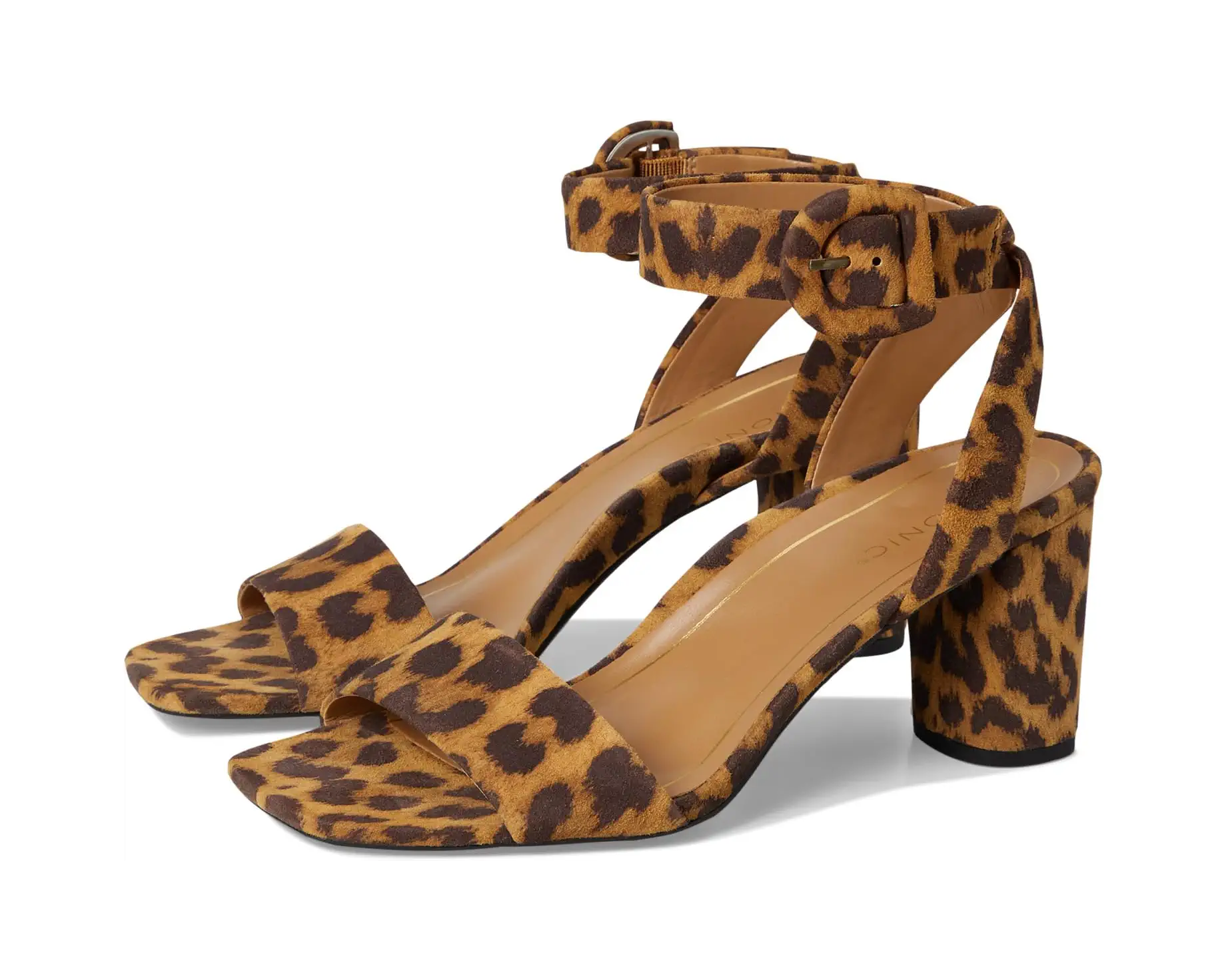 Leopard print block-heel pumps styled with a black halter top and brown faux fur cropped jacket