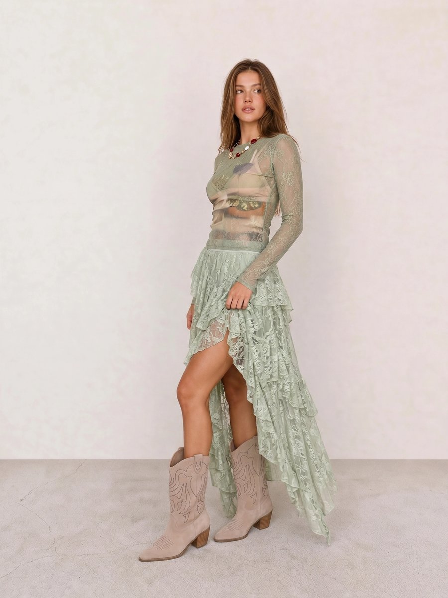 Boho outfit with a sheer sage lace top, ruffled lace maxi skirt, and taupe suede cowboy boots