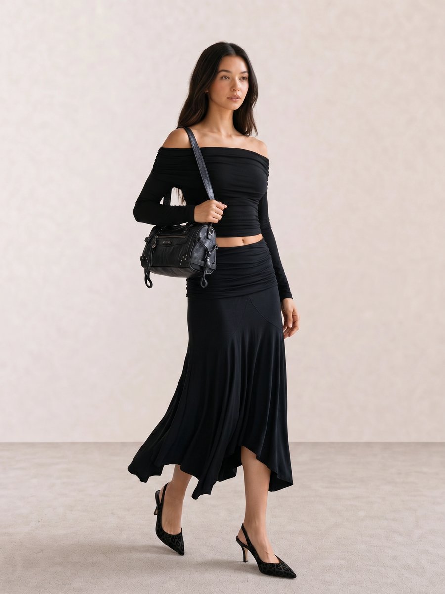 Black outfit with an off-shoulder ruched top, asymmetric midi skirt, studded bag, and leopard slingback heels