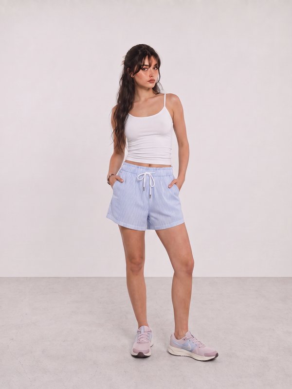 White Cami and Blue Stripe Shorts Travel Outfit