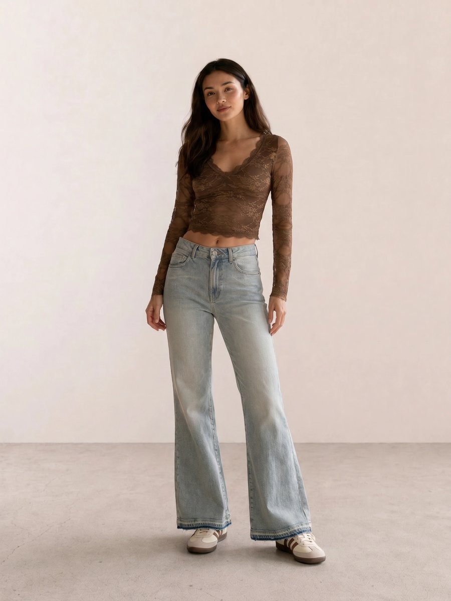 Retro vintage outfit with brown lace long-sleeve crop top, wide bell-bottom flare jeans, and Adidas sneakers