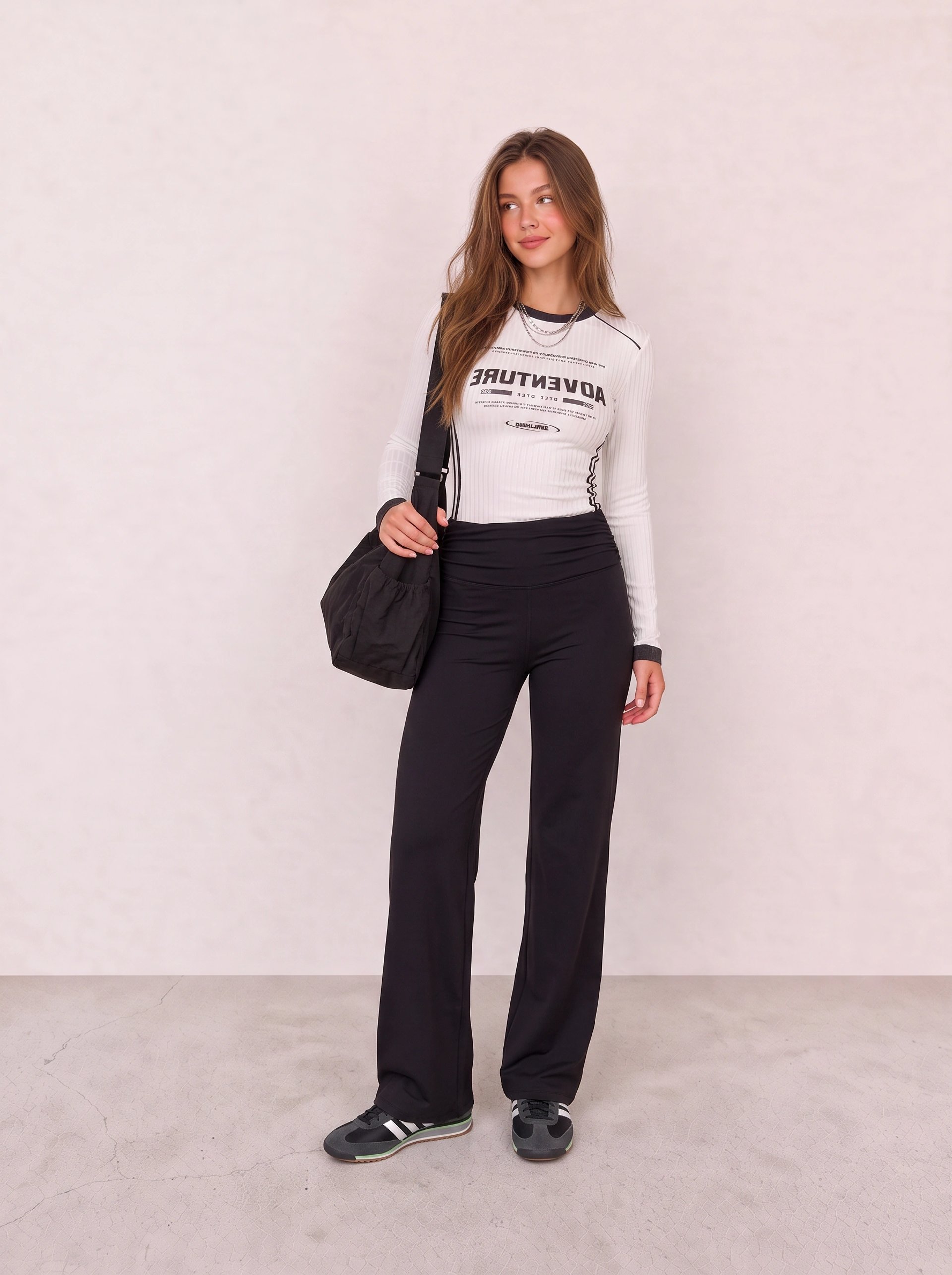 White Graphic Top and Black Flared Leggings Outfit
