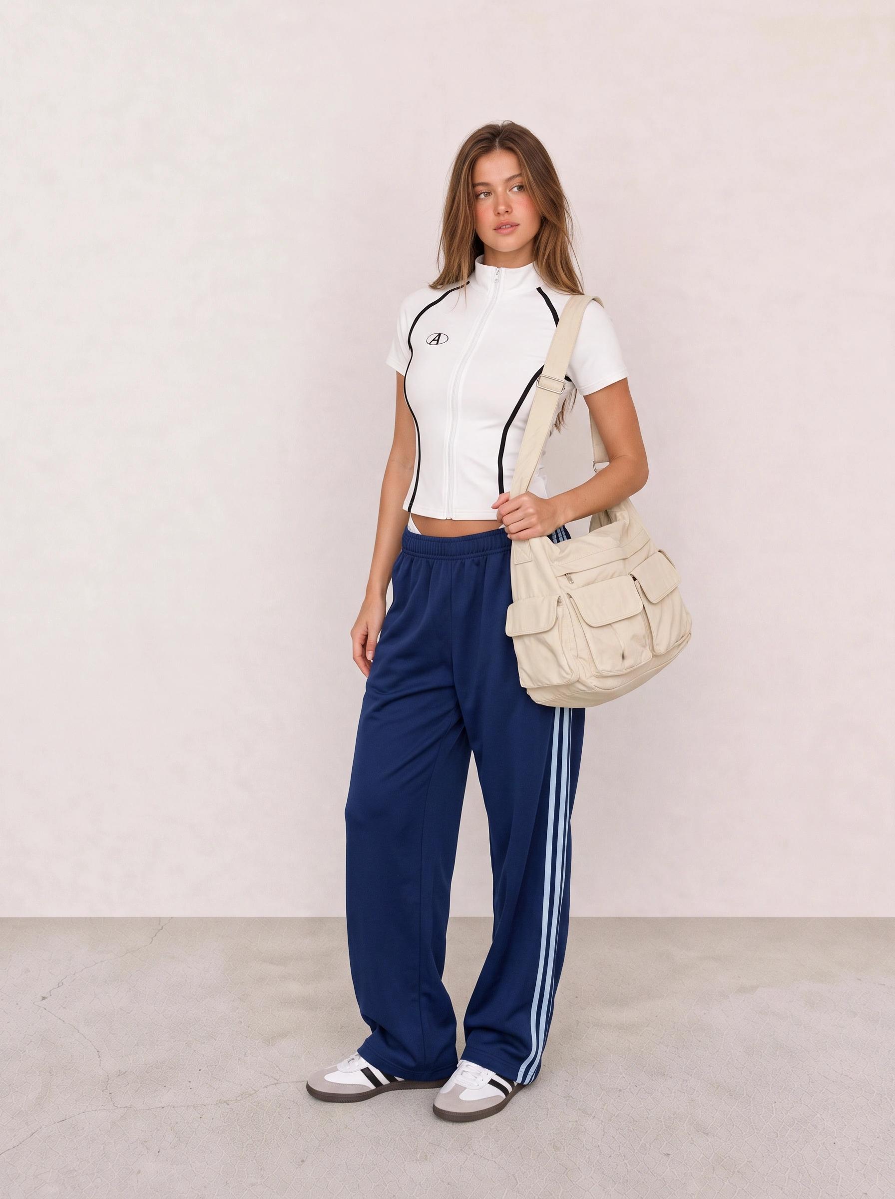 White Zip Top and Blue Track Pants Athleisure Outfit
